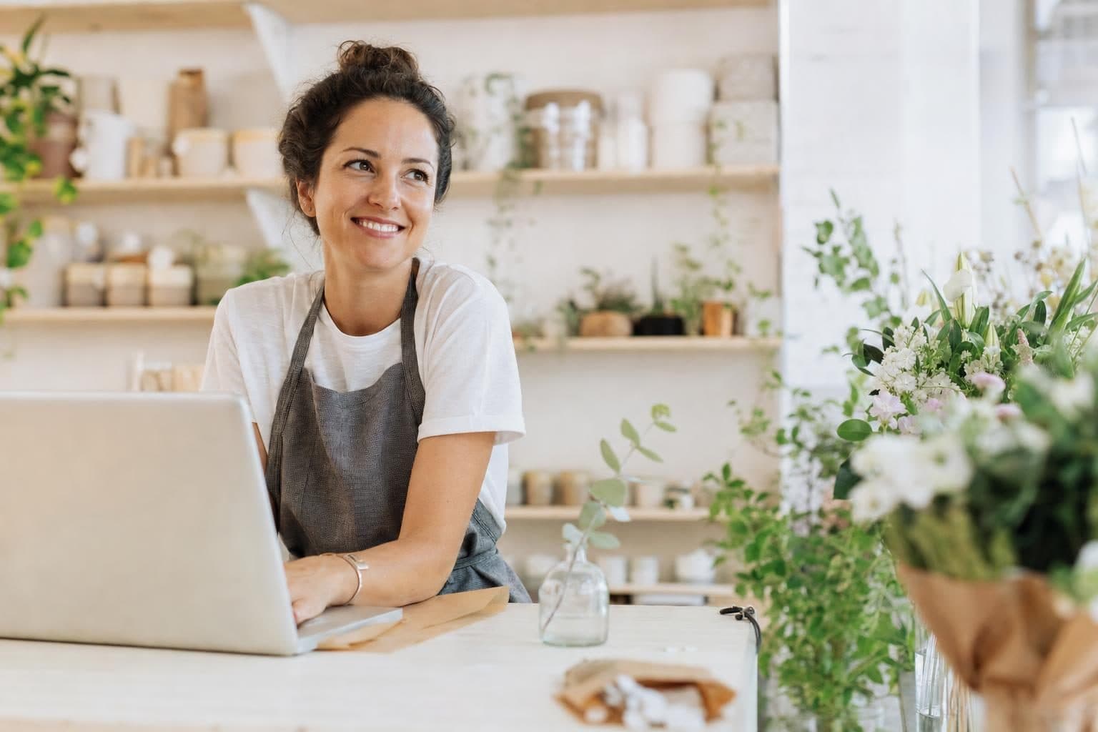 A local business owner at work while calls are answered