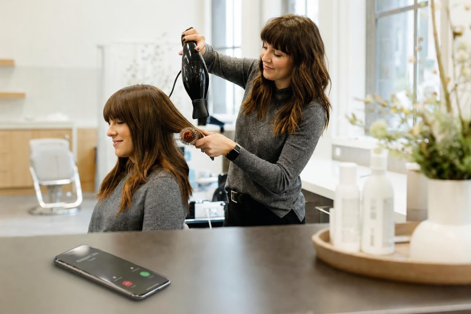 A busy salons & beauty business at work while calls are answered